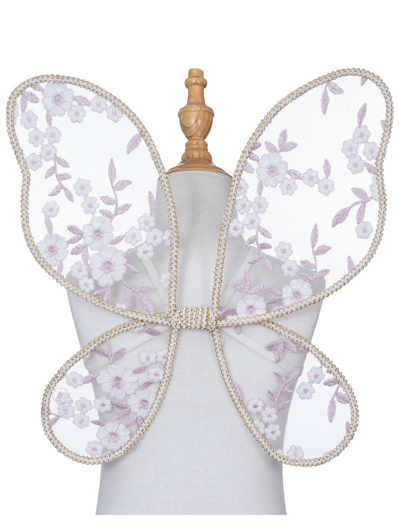 Butterfly wings with floral design and pearl accents on a mannequin.