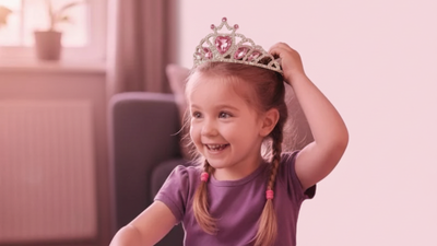a little girl with a little miss diva crown