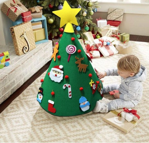 Children's felt Christmas tree with decorations in a living room setting.