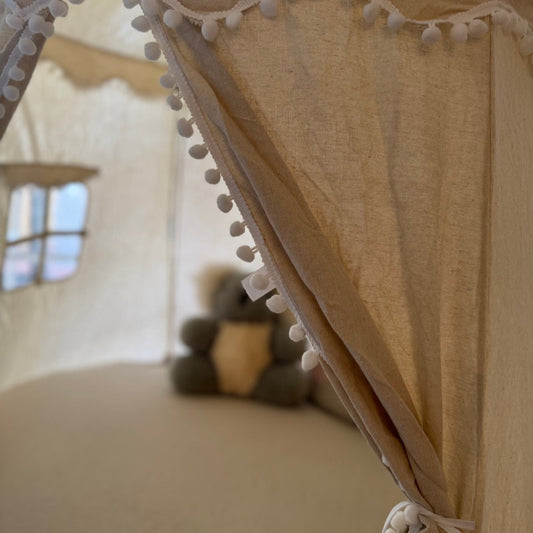 A light beige kids playtent, playcastle, teepee, play house
