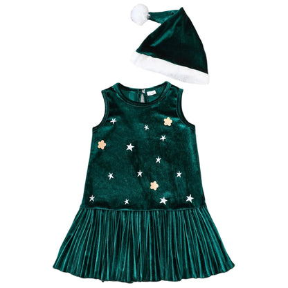 Green velvet dress with star patterns and matching hat on a gray background