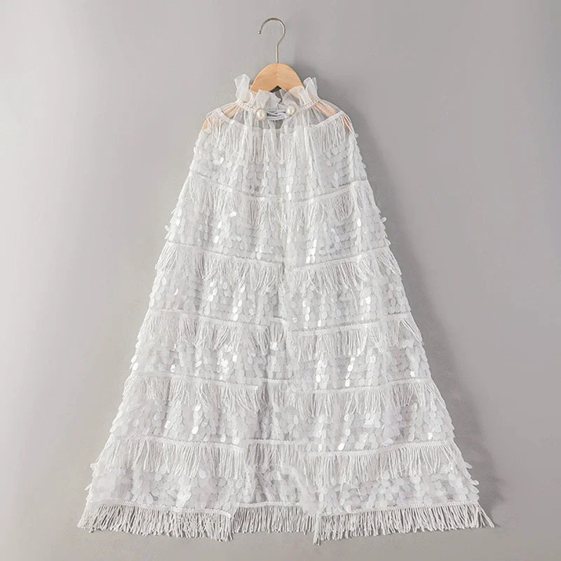 White lace dress on a hanger against a gray background