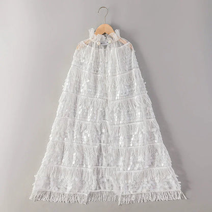 White lace dress on a hanger against a gray background