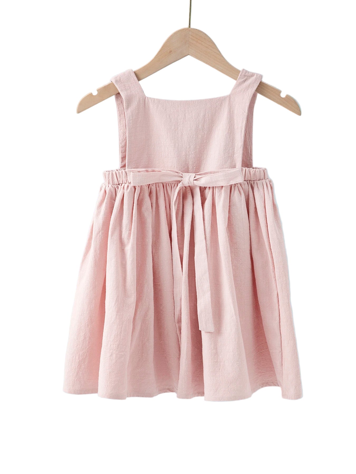 Pink dress on a hanger against a light blue background