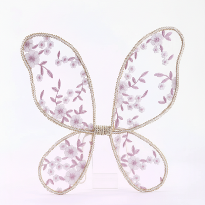 Butterfly-shaped decorative item with floral pattern on a white background