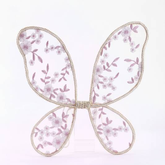 Butterfly-shaped decorative item with floral pattern on a white background